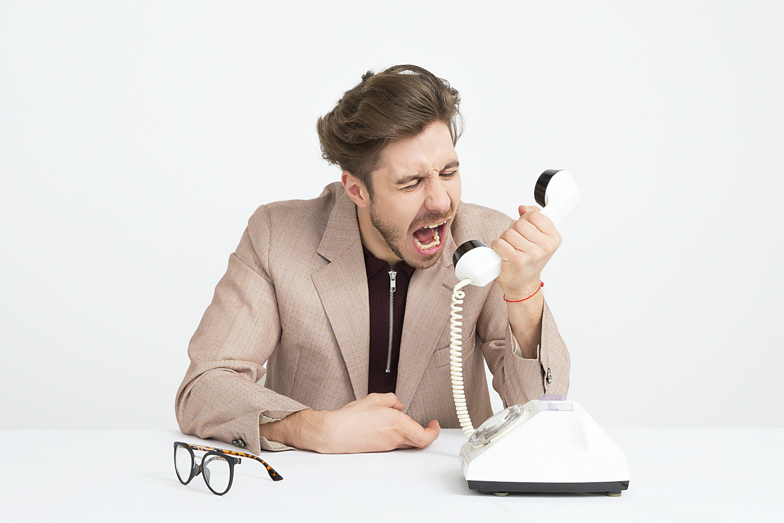 Man screaming into phone