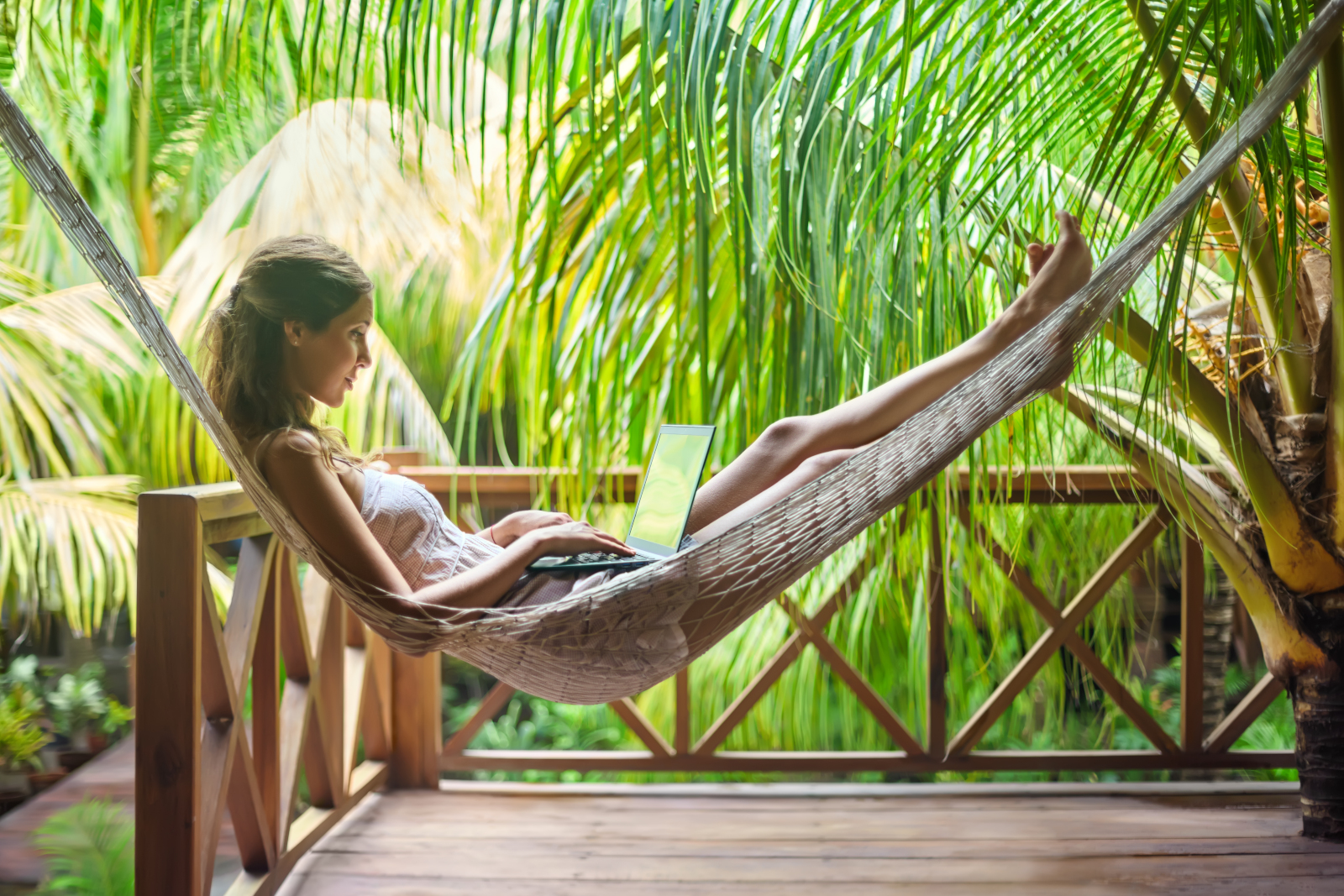 Woman in hammock in tropical paradise