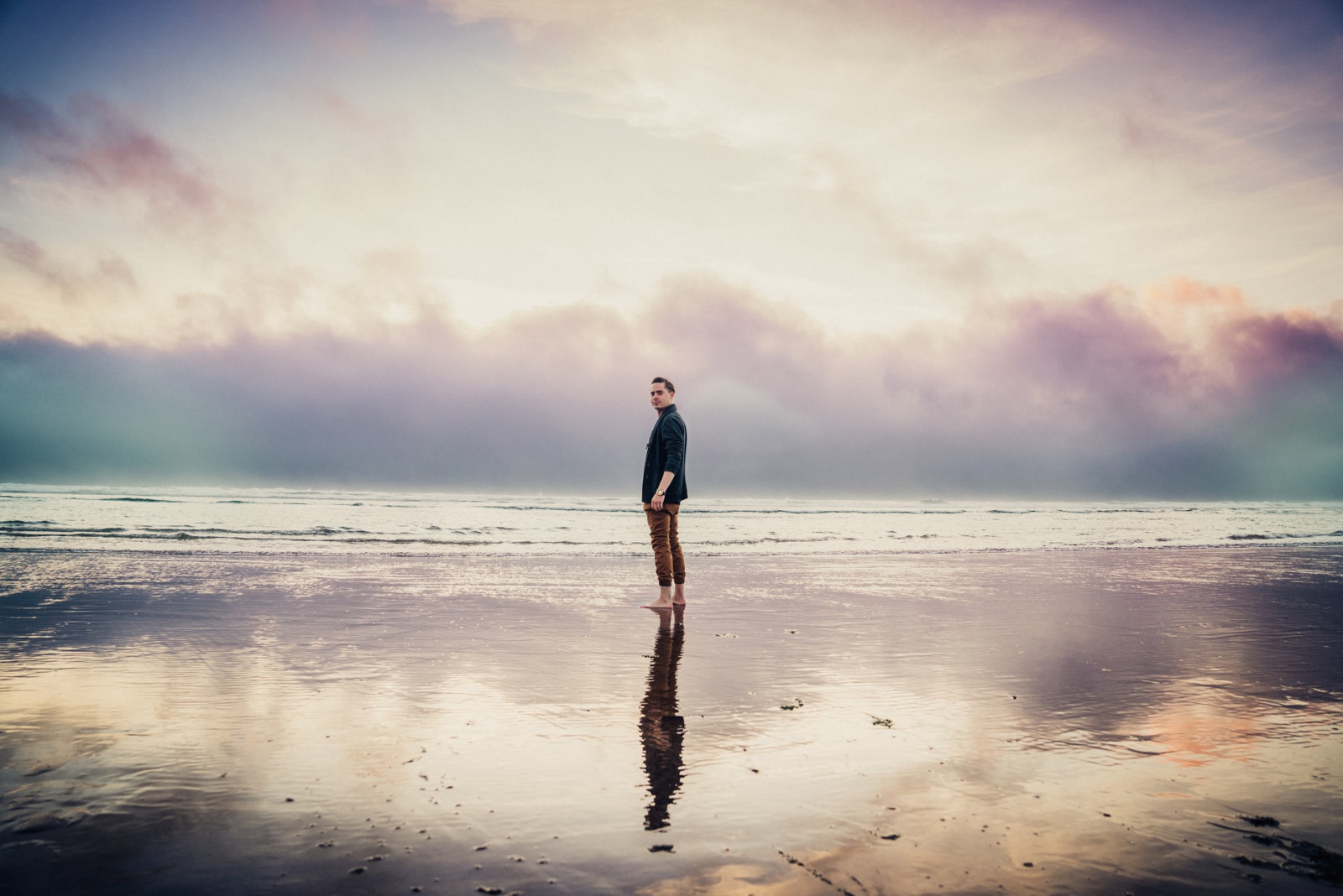 Man standing alone on a beach